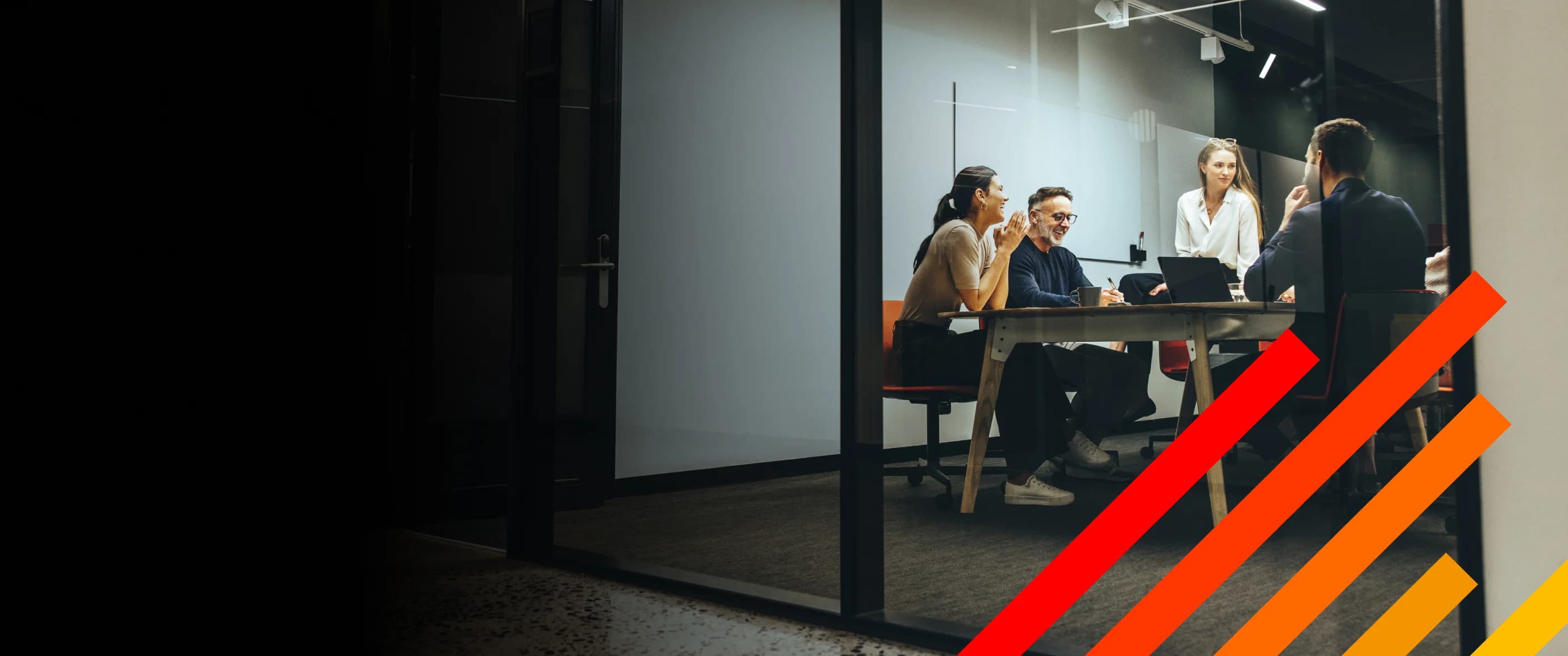 Group of legal professionals working in an office conference room.