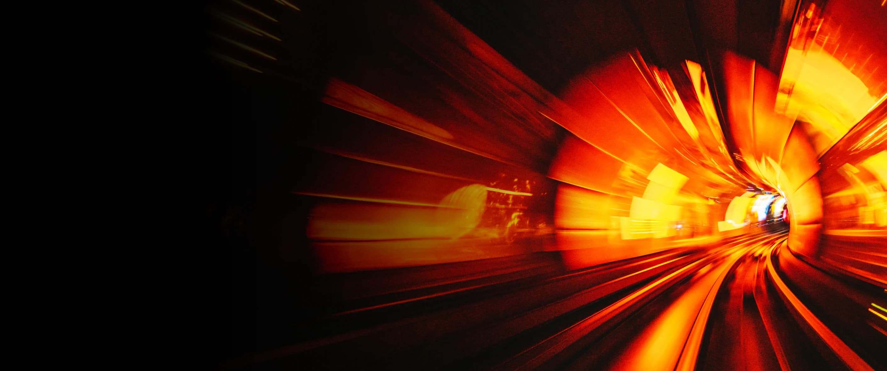 Abstract image of morae brand colored light receding in a curved tunnel